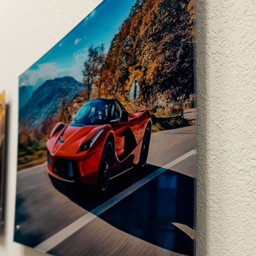 Acrylic print of a red Ferrari on polished standoff mounts