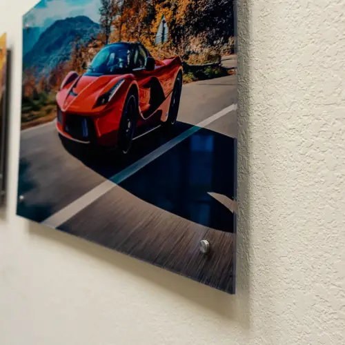 Acrylic print of a red Ferrari on polished standoff mounts