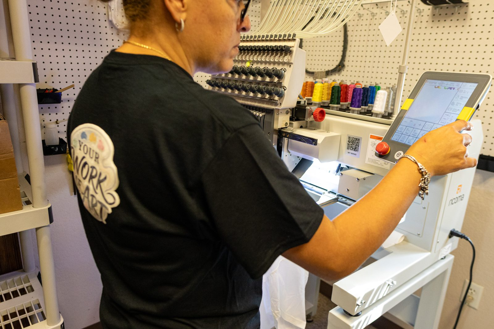 Embroidery machine stitching a design