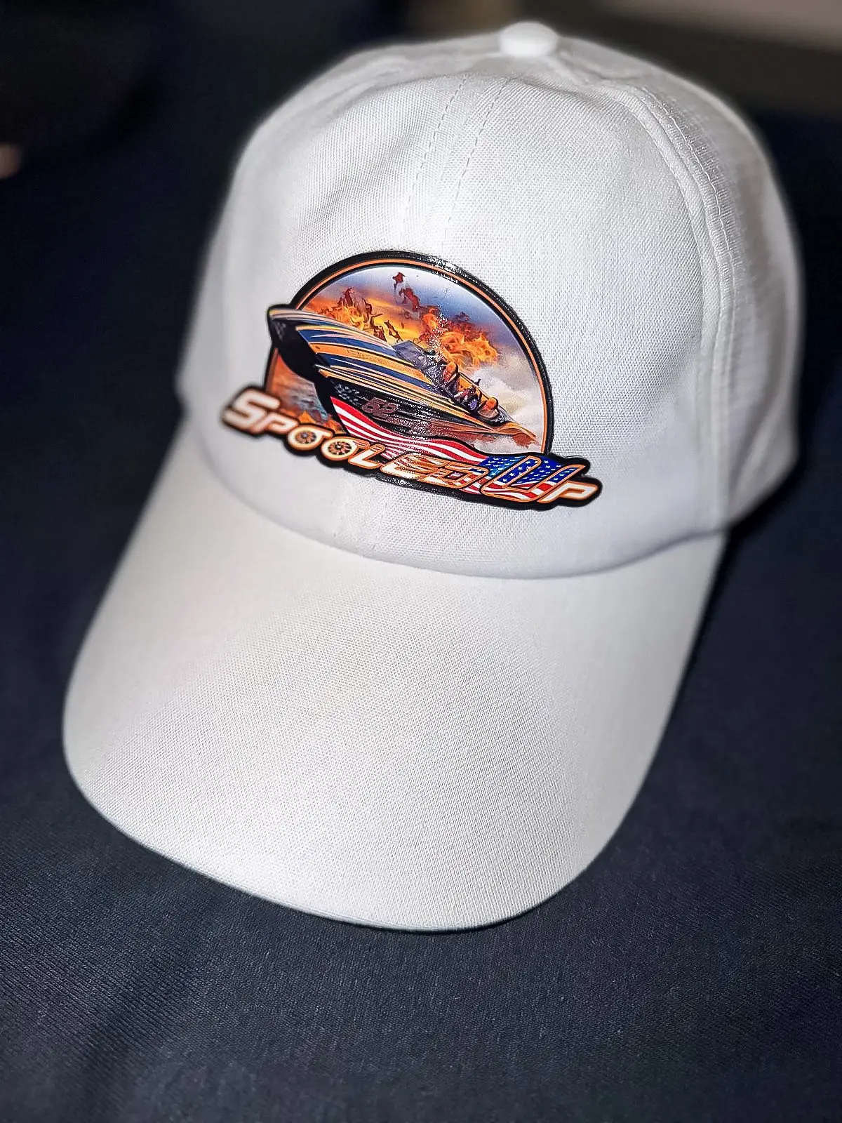 Close-up of the Spooled Up patch on a cap