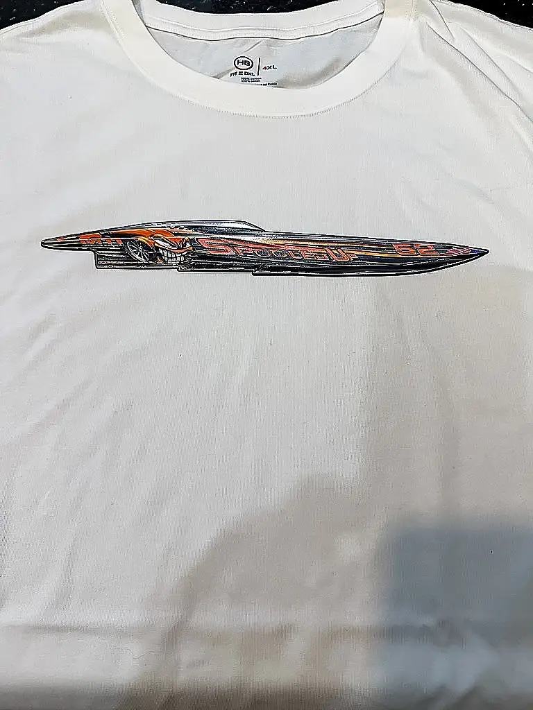 Spooled Up boat patch on a white shirt
