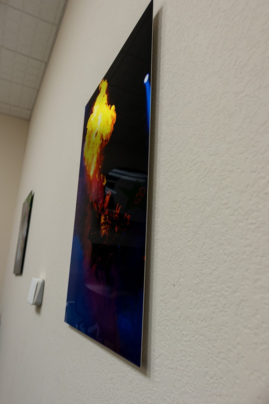 Metal print of a fire photo hanging on a wall