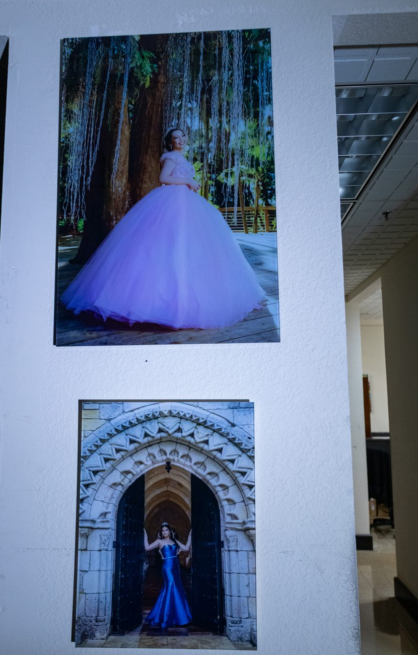 Two portrait prints hung in a hallway