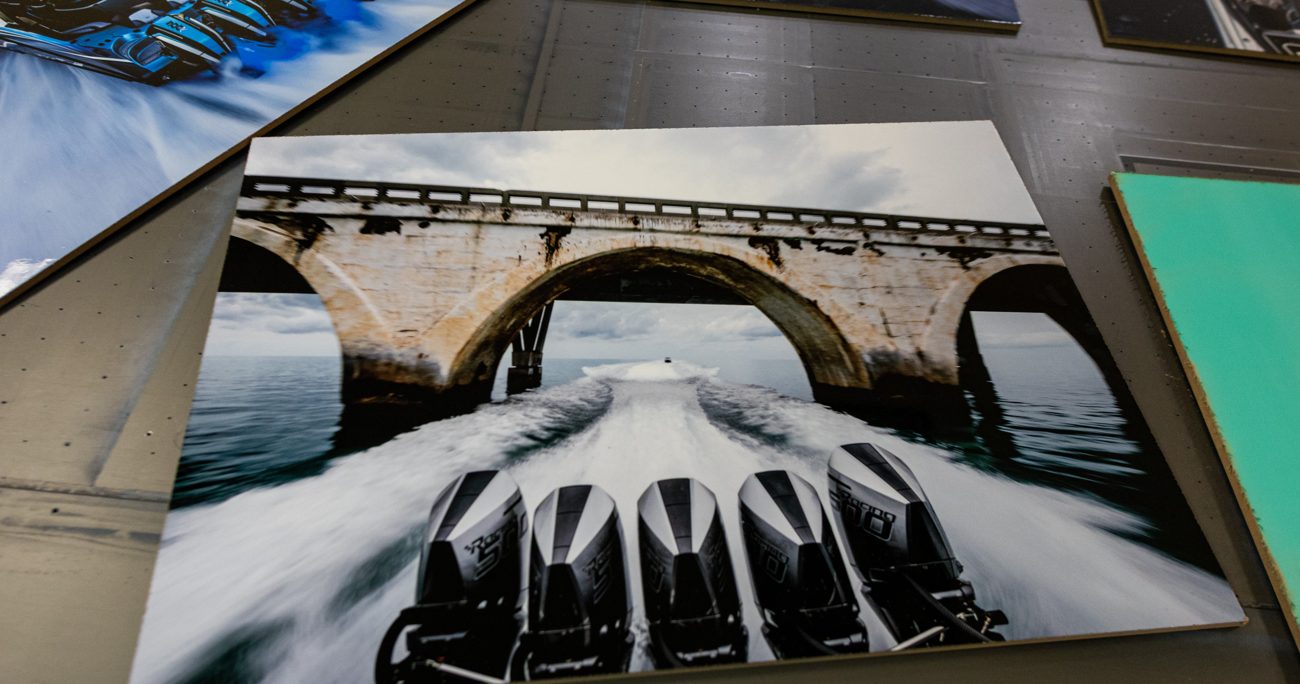 Finished photo prints coming off the flatbed press