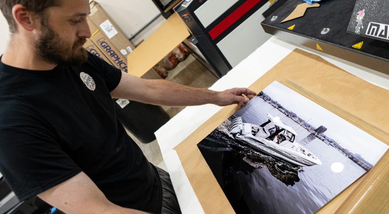Positioning a finished print at the press