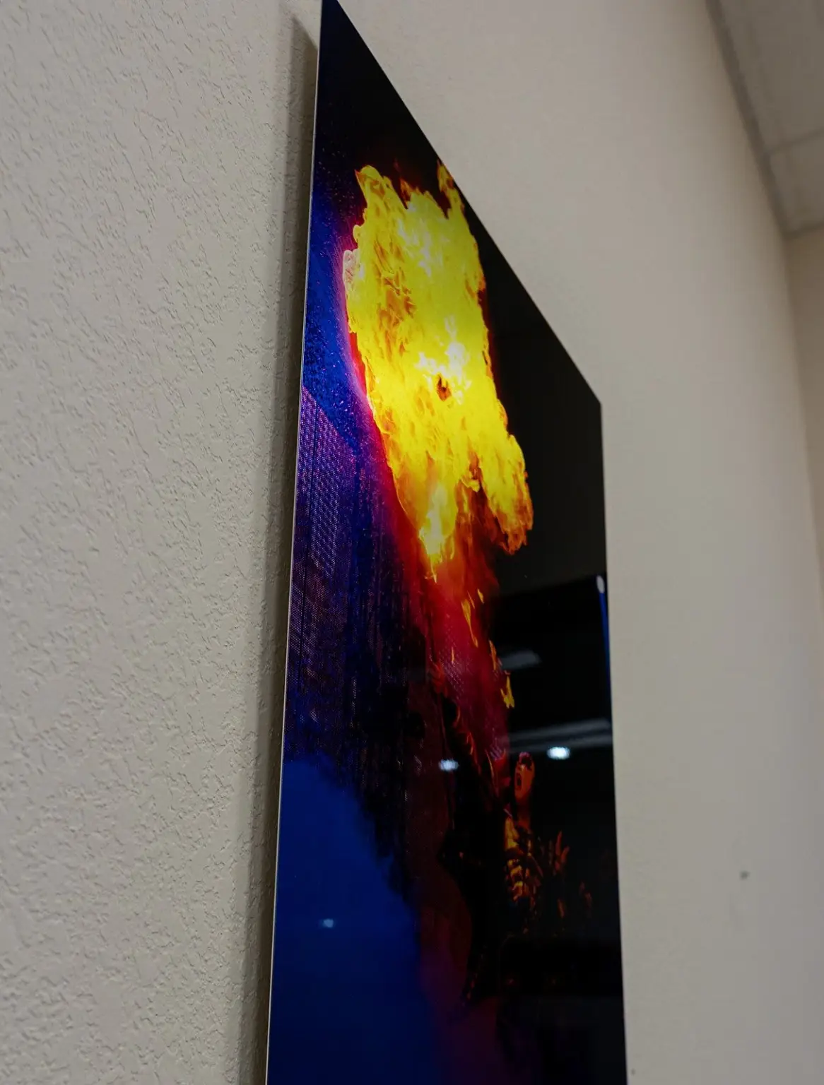 Metal print of a fire photo, angled on a table