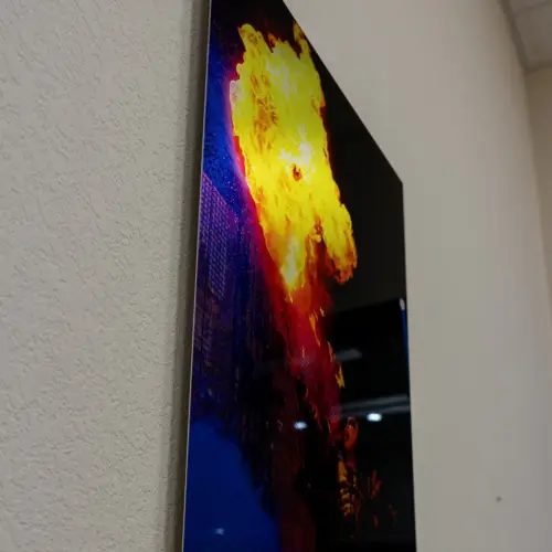 Metal print of a fire photo, angled on a table