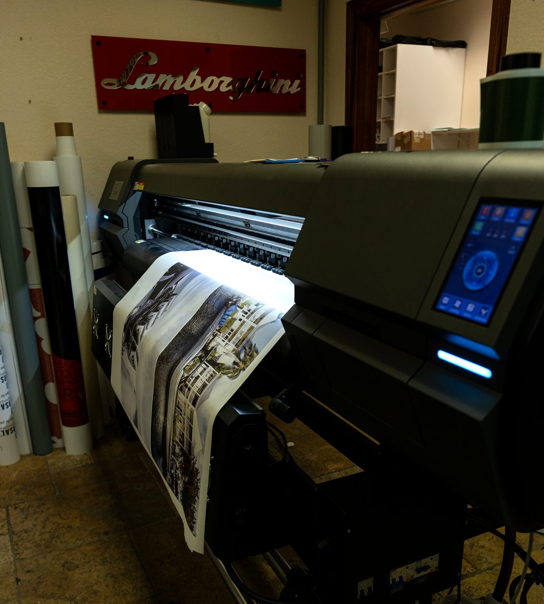 Wide format printer running a print in the Fort Lauderdale shop