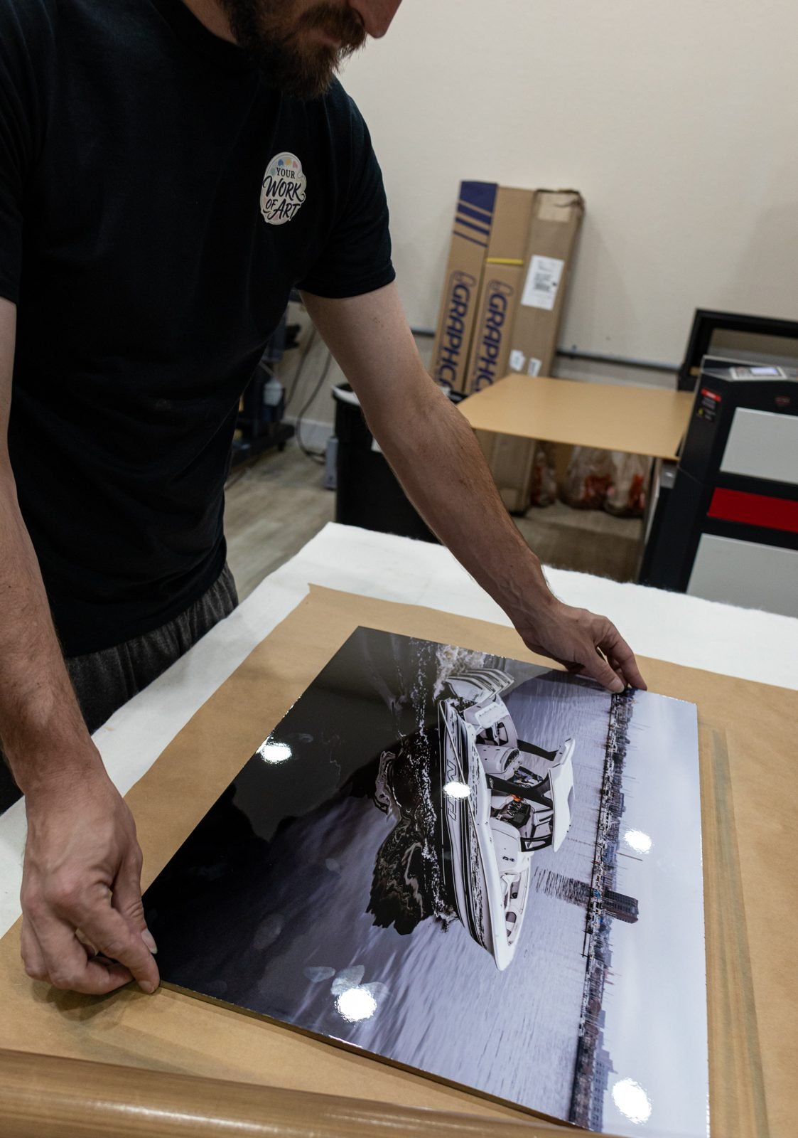 Checking a metal print fresh off the press